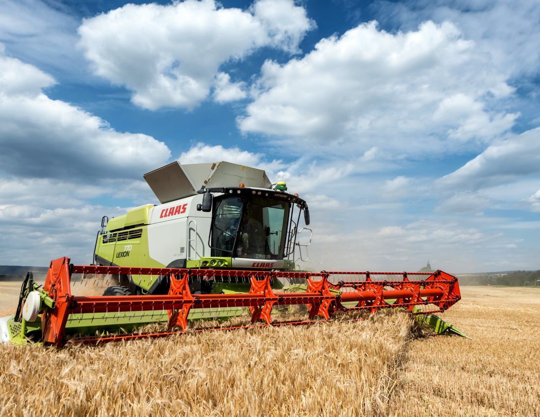 Illustrative stock photo: A combine harvester in a field.